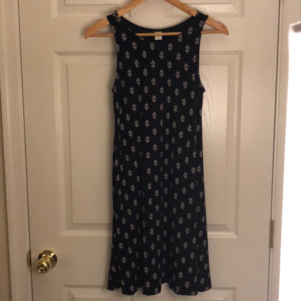 Black sundress with white pattern.